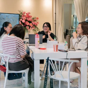 Participants and instructor at a previous Fluff’s Flowers workshop